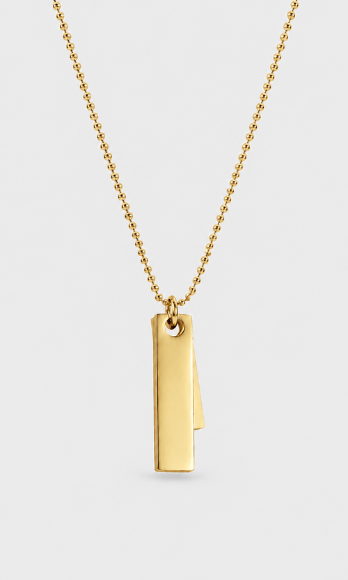 A gold ball chain necklace with a minimalist, double-layered vertical rectangular bar pendant, shown against a light gray background.