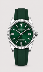 Aneesa wrist watch with a green dial and green rubber strap, featuring a silver fluted bezel and date window, shown against a light gray background.