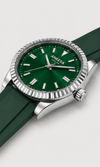 Aneesa wrist watch with a green dial and green rubber strap, featuring a silver fluted bezel and date window, shown against a light gray background.