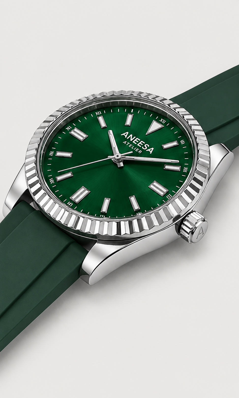 Aneesa wrist watch with a green dial and green rubber strap, featuring a silver fluted bezel and date window, shown against a light gray background.