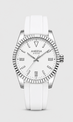 Aneesa wrist watch with a white dial, silver-tone fluted bezel, and a white silicone strap, centered on a light gray background.