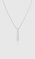 Shop the ANEESA Monolith — a silver bar pendant necklace on a 50cm snake chain. Minimalist stainless steel design, built for everyday wear.