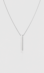Shop the ANEESA Monolith — a silver bar pendant necklace on a 50cm snake chain. Minimalist stainless steel design, built for everyday wear.