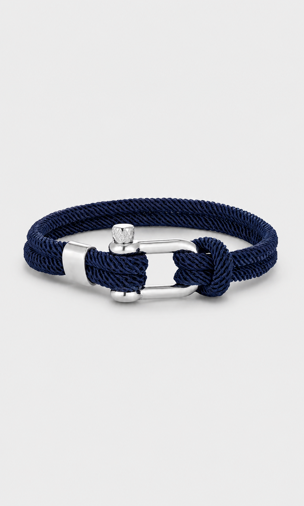 A navy blue braided rope bracelet with a silver-toned buckle and knot closure, displayed on a light gray background.