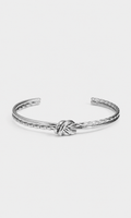 A silver-toned metal cuff bracelet featuring a central knotted detail and textured twisted edges, displayed on a clean, light gray background.