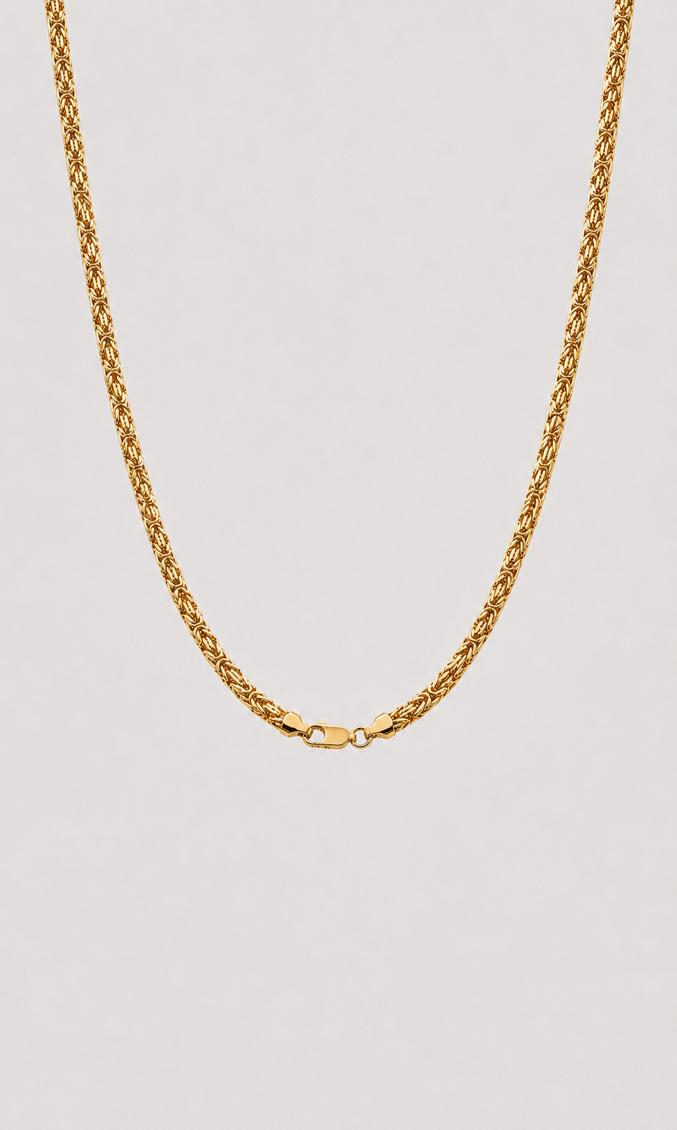 A gold rope chain necklace with a lobster clasp, shown against a solid light gray background.