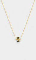 Shop the ANEESA Sage — a gold-plated pendant necklace with a baguette zircon stone. Delicate cable chain design