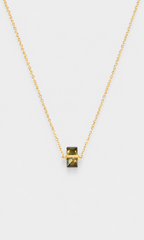 Shop the ANEESA Sage — a gold-plated pendant necklace with a baguette zircon stone. Delicate cable chain design
